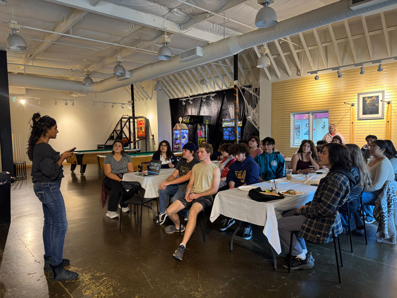 students at October TLC meeting listening to a speaker